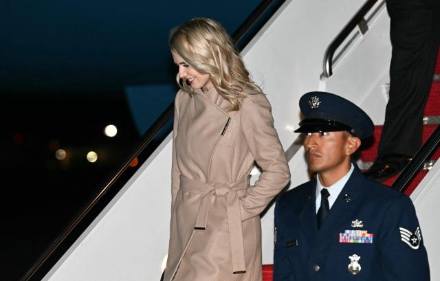 Executive assistant to the president Natalie Harp disembarks from Air Force One at Joint Base Andrews, Maryland on October 22, 2026. President Trump is returning to Washington, DC after speaking at a midterm campaign rally in Iowa. (Photo by Kent NISHIMURA / AFP)