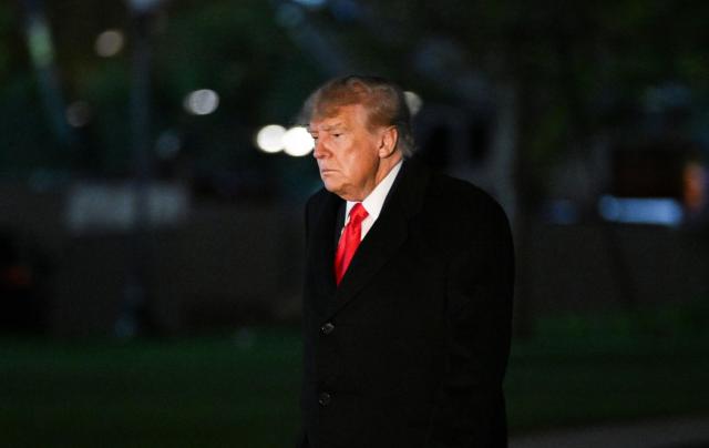 US President Donald Trump arrives on the South Lawn of the White House in Washington, DC, early morning on October 23, 2026. President Trump is returning to Washington, DC after speaking at a midterm campaign rally in Iowa. (Photo by Alex WROBLEWSKI / AFP)