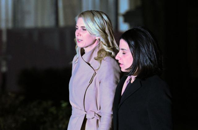 Executive assistant to the president Natalie Harp and political communications adviser Danielle Alvarez arrive on the South Lawn of the White House in Washington, DC, early morning of October 23, 2026. President Trump is returning to Washington, DC after speaking at a midterm campaign rally in Iowa. (Photo by Alex WROBLEWSKI / AFP)