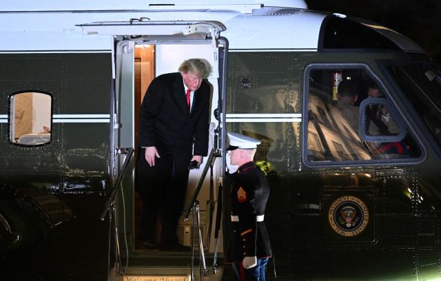US President Donald Trump steps off Marine One on the South Lawn of the White House in Washington, DC, early morning on October 23, 2026. President Trump is returning to Washington, DC after speaking at a midterm campaign rally in Iowa. (Photo by Alex WROBLEWSKI / AFP)