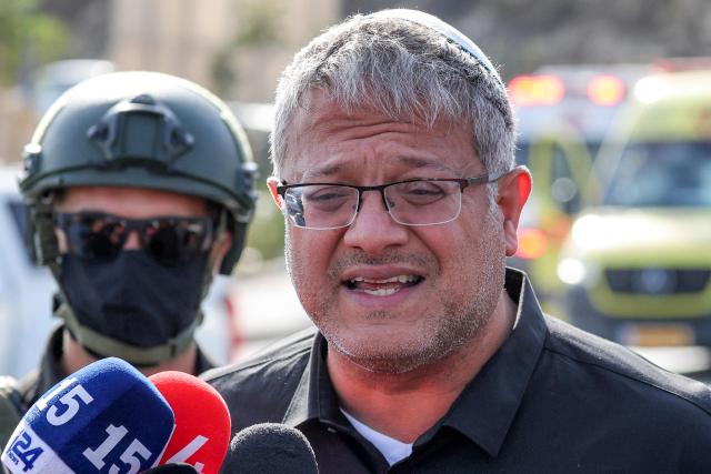 Itamar Ben Gvir, Israel's national security minister and head of the far-right Otzma Yehudit (Jewish Power) party, speaks to the media at the scene following a fire exchange between armed Palestinians and Israeli forces at the northern checkpoint of Hebron in the Israeli-occupied West Bank on October 23, 2026. Israeli troops on October 23 shot dead two suspected Palestinian assailants in the West Bank after a shooting that left at least five people wounded, officials said. (Photo by Ahmad GHARABLI / AFP)