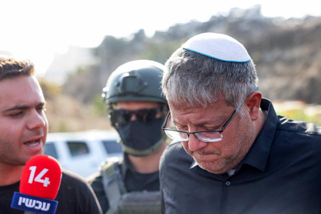 Itamar Ben Gvir, Israel's national security minister and head of the far-right Otzma Yehudit (Jewish Power) party, reacts as he speaks to the media at the scene following a fire exchange between armed Palestinians and Israeli forces at the northern checkpoint of Hebron in the Israeli-occupied West Bank on October 23, 2026. Israeli troops on October 23 shot dead two suspected Palestinian assailants in the West Bank after a shooting that left at least five people wounded, officials said. (Photo by AHMAD GHARABLI / AFP)