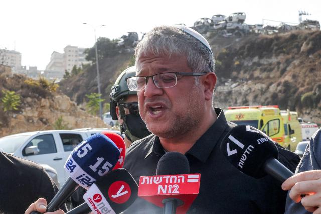 Itamar Ben Gvir, Israel's national security minister and head of the far-right Otzma Yehudit (Jewish Power) party, speaks to the media at the scene following a fire exchange between armed Palestinians and Israeli forces at the northern checkpoint of Hebron in the Israeli-occupied West Bank on October 23, 2026. Israeli troops on October 23 shot dead two suspected Palestinian assailants in the West Bank after a shooting that left at least five people wounded, officials said. (Photo by AHMAD GHARABLI / AFP)