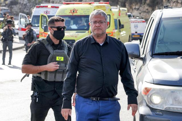 Itamar Ben Gvir, Israel's national security minister and head of the far-right Otzma Yehudit (Jewish Power) party, arrives at the scene following a fire exchange between armed Palestinians and Israeli forces at the northern checkpoint of Hebron in the Israeli-occupied West Bank on October 23, 2026. Israeli troops on October 23 shot dead two suspected Palestinian assailants in the West Bank after a shooting that left at least five people wounded, officials said. (Photo by AHMAD GHARABLI / AFP)
