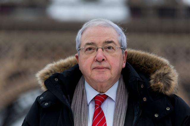 (FILES) Ile-de-France regional council's president Jean-Paul Huchon attends the presentation of a new generation of ecological buses of RATP on December 2, 2015 in Paris. Jean-Paul Huchon, the former Socialist president of the Ile-de-France region, died overnight on October 22, 2026 at the age of 80 following a battle with cancer, one of his sons announced to AFP. Jean-Paul Huchon served as president of the Ile-de-France regional council from 1998 to 2015 and had previously been chief of staff to Prime Minister Michel Rocard. (Photo by KENZO TRIBOUILLARD / AFP)