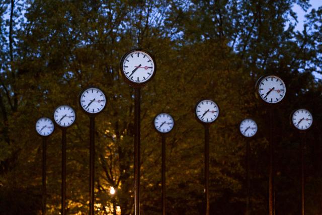 Clocks of the art installation 'Zeitfeld' (time field) by German artist Klaus Rinke are seen in Duesseldorf, western Germany, on October 23, 2026. Daylight Saving Time will end on October 25, 2026, and clocks will be turned one hour backward for winter time. (Photo by Ina FASSBENDER / AFP)