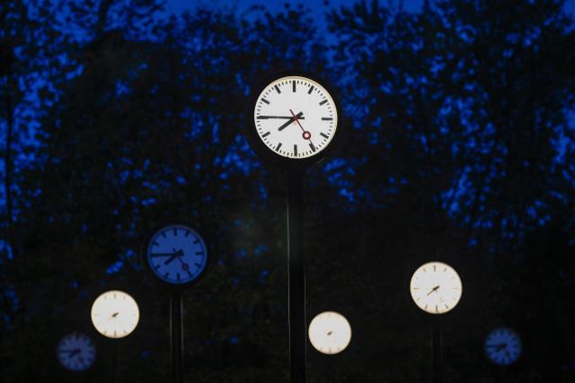 Clocks of the art installation 'Zeitfeld' (time field) by German artist Klaus Rinke are seen in Duesseldorf, western Germany, on October 23, 2026. Daylight Saving Time will end on October 25, 2026, and clocks will be turned one hour backward for winter time. (Photo by Ina FASSBENDER / AFP)