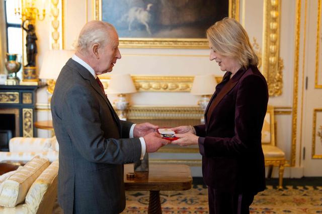 Britain's King Charles III presents the King's Medal for Music to Dame Sarah Connolly, during an audience at Windsor Castle, west of London on October 23, 2026. (Photo by Aaron Chown / POOL / AFP)