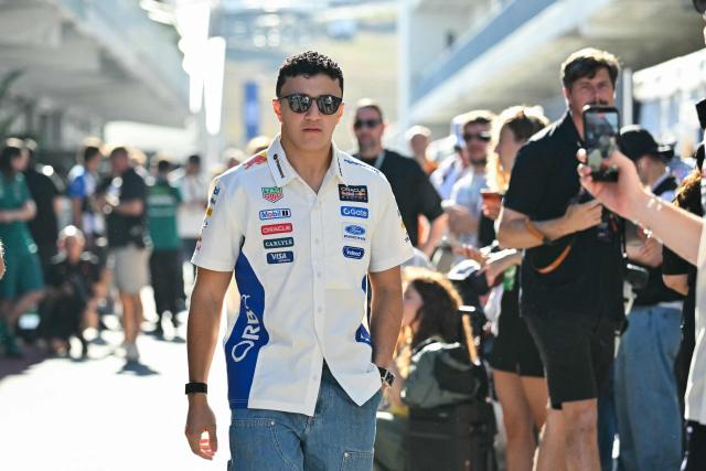 Red Bull Racing's French driver Isack Hadjar arrives in the paddock ahead of the practice session for the United States Formula One Grand Prix at the Circuit of the Americas in Austin, Texas, on October 23, 2026. (Photo by ANGELA WEISS / AFP)