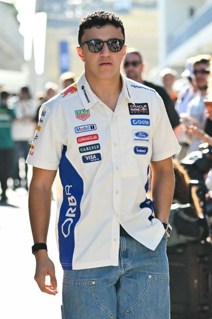 Red Bull Racing's French driver Isack Hadjar arrives in the paddock ahead of the practice session for the United States Formula One Grand Prix at the Circuit of the Americas in Austin, Texas, on October 23, 2026. (Photo by ANGELA WEISS / AFP)