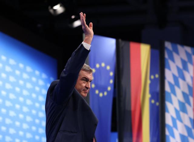 Bavaria's State Premier and leader of the conservative Christian Social Union (CSU) Markus Soeder waves after delivering a speech during the Christian Social Union (CSU) party congress in Munich, on October 23, 2026. (Photo by Alexandra BEIER / AFP)