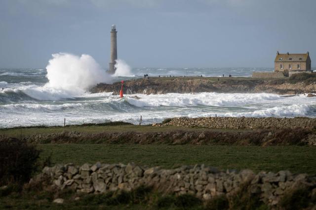 This photograph shows the Goury Lighthouse off La Hague, northwestern France, on October 23, 2026, as the storm Austen hits the coasts of France. (Photo by Guillaume SALIGOT / AFP)