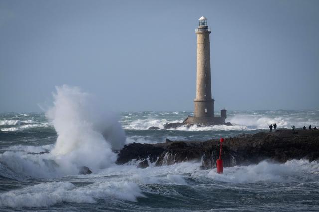 This photograph shows the Goury Lighthouse off La Hague, northwestern France, on October 23, 2026, as the storm Austen hits the coasts of France. (Photo by Guillaume SALIGOT / AFP)