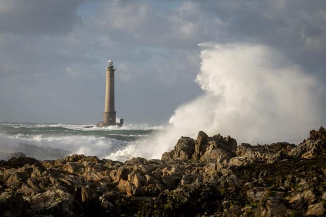 This photograph shows the Goury Lighthouse off La Hague, northwestern France, on October 23, 2026, as the storm Austen hits the coasts of France. (Photo by Guillaume SALIGOT / AFP)