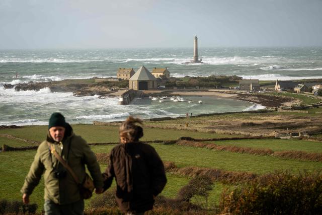 This photograph shows the Goury Lighthouse off La Hague, northwestern France, on October 23, 2026, as the storm Austen hits the coasts of France. (Photo by Guillaume SALIGOT / AFP)