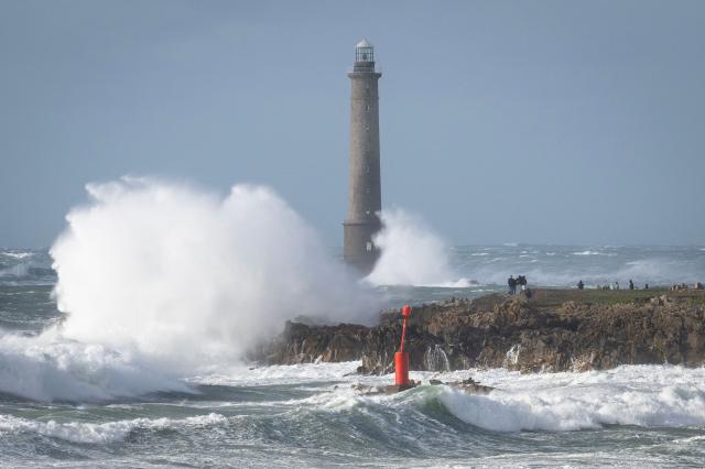 This photograph shows the Goury Lighthouse off La Hague, northwestern France, on October 23, 2026, as the storm Austen hits the coasts of France. (Photo by Guillaume SALIGOT / AFP)