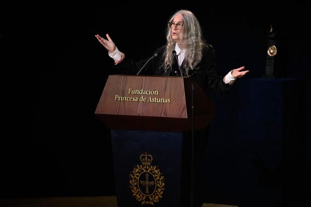 U.S. singer Patti Smith sings during a speech after receiving the 2026 Princess of Asturias Award for the Arts during the 2026 Princess of Asturias Awards ceremony at the Campoamor theatre in Oviedo on October 23, 2026. (Photo by ANDER GILLENEA / AFP)