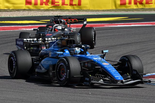 Williams' Thai driver Alexander Albon races followed by Audi's German driver Nico Hulkenberg during a practice session for the United States Formula One Grand Prix at the Circuit of the Americas in Austin, Texas, on October 23, 2026. (Photo by RONALDO SCHEMIDT / AFP)