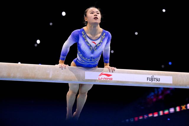 China's Qingying Zhang competes on the Balance Beam in the Women's Individual All-Around Final during the 54th FIG Artistic Gymnastics World Championships, in Rotterdam, southern Netherlands, on October 23, 2026. (Photo by JOHN THYS / AFP)