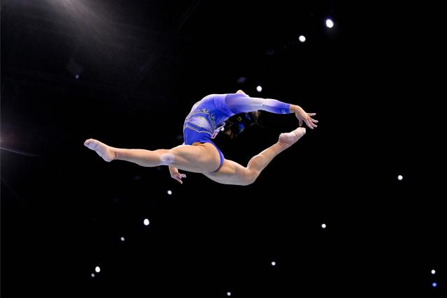 China's Qingying Zhang competes on the Balance Beam in the Women's Individual All-Around Final during the 54th FIG Artistic Gymnastics World Championships, in Rotterdam, southern Netherlands, on October 23, 2026. (Photo by JOHN THYS / AFP)