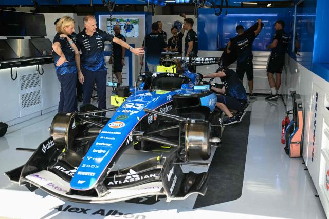 Williams' technicians work on the car of Williams' Thai driver Alexander Albon in the garage before the start of the second practice session for the United States Formula One Grand Prix at the Circuit of the Americas in Austin, Texas, on October 23, 2026. (Photo by RONALDO SCHEMIDT / AFP)