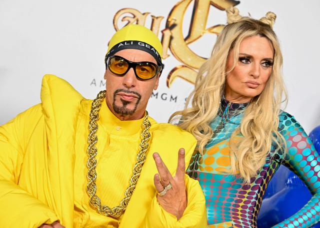 (FILES) English actor and comedian Sacha Baron Cohen, dressed as his satirical fictional character Ali G, and Australian comedian Morgana Robinson attend the premiere of Amazon MGM Studio's "Ali G: Who Iz I?" at the Hollywood American Legion Post 43 in Los Angeles on October 14, 2026. With "Ali G: Who Iz I?" Sacha Baron Cohen has returned to the guerrilla-style comedy that catapulted him to global fame -- but this time, the character has faced criticsm.
The film, which marks the comedian's debut as director, revives the persona that originated in a British television segment and went on to star in "Da Ali G Show."
In the series, Cohen plays a white man obsessed with hip-hop and reggae who would interview public figures including Donald Trump and Buzz Aldrin -- and they weren't in on the joke. (Photo by Katie FLORES / AFP)