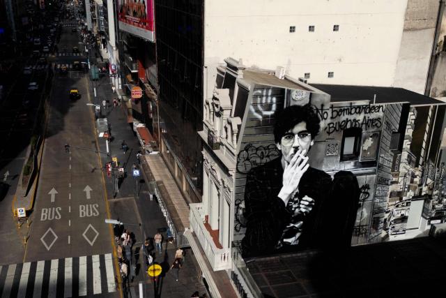 View of a mural by Martin Ron depicting Argentina's music icon Charly Garcia during his 75th birthday in Buenos Aires on October 23, 2026. (Photo by Luis ROBAYO / AFP)