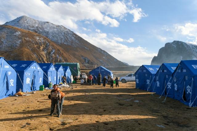 Tents housing quake-affected residents are seen at a site in Baqing county following a 7.0-magnitude earthquake in the county's Bangyunang Village, Nagqu, in China’s western Tibet region, on October 23, 2026. China ordered an "all-out" rescue effort in a remote area of Tibet on October 23 after an earthquake killed at least 16 people and injured dozens more, state media reported. (Photo by CNS / AFP) / China OUT