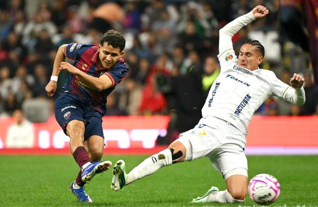 Atlante's defender #06 Nico Carrera and San Luis' midfielder #07 Benjamin Galdames fight for the ball during the Liga MX Apertura tournament football match between Atlante and San Luis at the Banorte stadium in Mexico City on October 23, 2026. (Photo by Yuri CORTEZ / AFP)