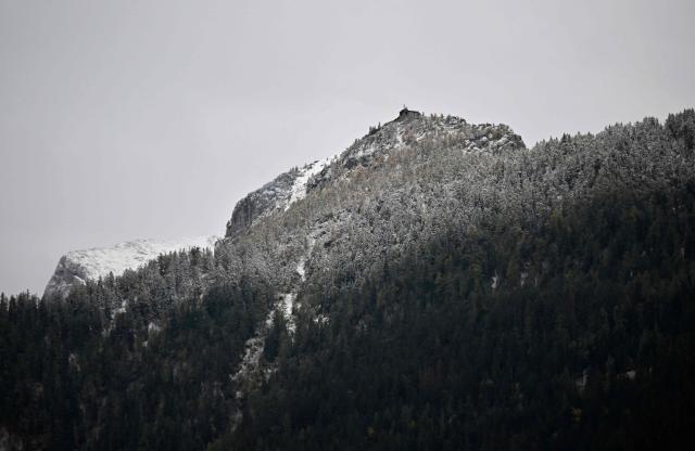 View taken on October 24, 2026 shows the mountain guesthouse Kehlsteinhaus (top), known as the Eagle's Nest, formerly Adolf Hitler's mountain retreat, after a large fire had broken out at the site located at an altitude of 1,834 metres (6,000 feet) in the mountains over Berchtesgaden, in the southern German state of Bavaria. Emergency services arrived on site on late October 23, 2026 and found a large fire. German police said on October 24, 2026 they have detained a suspect following a fire at Adolf Hitler's mountain retreat, known as the Eagle's Nest. (Photo by KERSTIN JOENSSON / AFP)