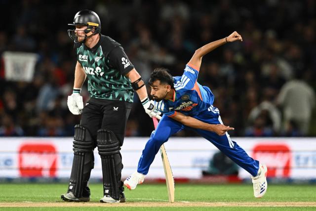 India's Prince Yadav (R) bowls as New Zealand's Glenn Phillips looks on during the second Twenty20 international cricket match between New Zealand and India at Hagley Oval in Christchurch on October 24, 2026. (Photo by Sanka VIDANAGAMA / AFP)