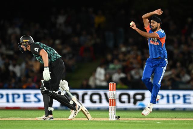 India's Arshdeep Singh (R) bowls as New Zealand's Bevon Jacobs looks on during the second Twenty20 international cricket match between New Zealand and India at Hagley Oval in Christchurch on October 24, 2026. (Photo by Sanka VIDANAGAMA / AFP)
