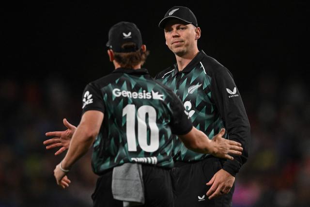 New Zealand's Michael Bracewell (R) interacts with a teammate during the second Twenty20 international cricket match between New Zealand and India at Hagley Oval in Christchurch on October 24, 2026. (Photo by Sanka VIDANAGAMA / AFP)