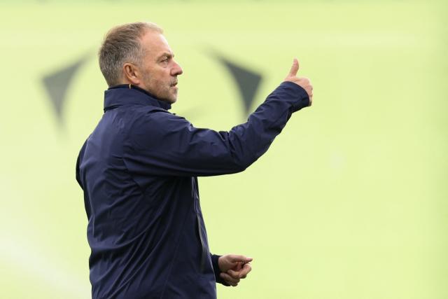 Barcelona's German coach Hans-Dieter Flick gestures during a training session on the eve of their Spanish league "Clasico" football match against Real Madrid CF at the Joan Gamper training ground in Sant Joan Despi, near Barcelona, on October 24, 2026 (Photo by Lluis GENE / AFP)