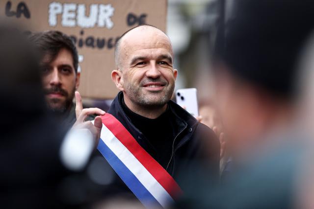 French leftist party La France Insoumise (LFI) group MP Manuel Bompard reacts during a demonstration in favor of purchasing power, the protection of public services, and fiscal and social justice, in Paris on October 24, 2026 as part of a nationwide call for mobilisation bringing together former members of the Yellow Vest movement, labor unions, high school and university students. Protests by high school students over learning conditions sparked a movement that has since spread nationwide, fuelled by broader anger over the rising cost of living. About 70,000 security personnel will be deployed on October 24, 2026, Interior Minister said at a news conference, warning that calls for violence and looting were circulating on social media. (Photo by Sameer AL-DOUMY / AFP)