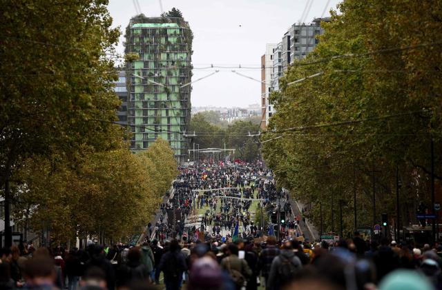 Protesters march as they take part in a demonstration in favor of purchasing power, the protection of public services, and fiscal and social justice, in Paris on October 24, 2026 as part of a nationwide call for mobilisation bringing together former members of the Yellow Vest movement, labor unions, high school and university students. Protests by high school students over learning conditions sparked a movement that has since spread nationwide, fuelled by broader anger over the rising cost of living. About 70,000 security personnel will be deployed on October 24, 2026, Interior Minister said at a news conference, warning that calls for violence and looting were circulating on social media. (Photo by Sameer AL-DOUMY / AFP)