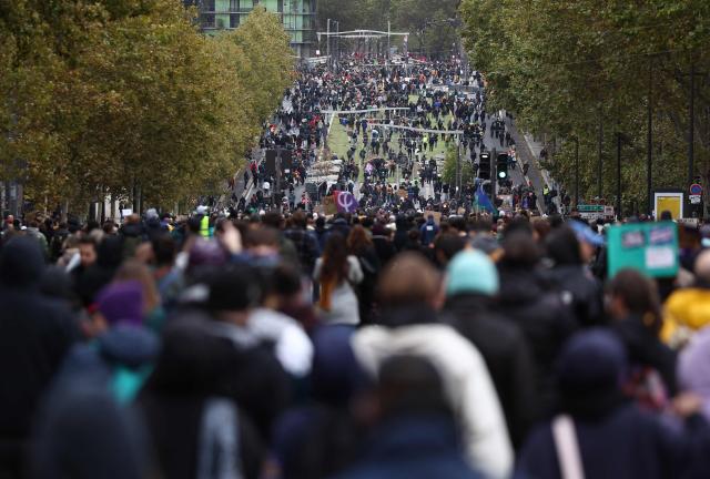 Protesters march as they take part in a demonstration in favor of purchasing power, the protection of public services, and fiscal and social justice, in Paris on October 24, 2026 as part of a nationwide call for mobilisation bringing together former members of the Yellow Vest movement, labor unions, high school and university students. Protests by high school students over learning conditions sparked a movement that has since spread nationwide, fuelled by broader anger over the rising cost of living. About 70,000 security personnel will be deployed on October 24, 2026, Interior Minister said at a news conference, warning that calls for violence and looting were circulating on social media. (Photo by Sameer AL-DOUMY / AFP)
