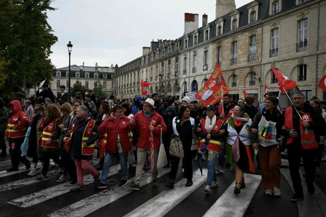 Members of the French trade union General Confederation of Labour (CGT) take part in a demonstration in favor of purchasing power, the protection of public services, and fiscal and social justice, in Bordeaux, western France on October 24, 2026 as part of a nationwide call for mobilisation bringing together former members of the Yellow Vest movement, labor unions, high school and university students. Protests by high school students over learning conditions sparked a movement that has since spread nationwide, fuelled by broader anger over the rising cost of living. About 70,000 security personnel will be deployed on October 24, 2026, Interior Minister said at a news conference, warning that calls for violence and looting were circulating on social media. (Photo by Philippe LOPEZ / AFP)