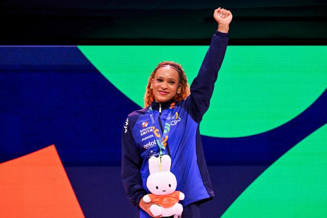Gold medallist Brazil's Rebeca Andrade celebrates on the podium after the Women's Vault Final during the 54th FIG Artistic Gymnastics World Championships, in Rotterdam, southern Netherlands, on October 24, 2026. (Photo by JOHN THYS / AFP)