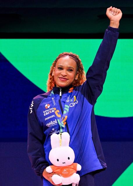 Gold medallist Brazil's Rebeca Andrade celebrates on the podium after the Women's Vault Final during the 54th FIG Artistic Gymnastics World Championships, in Rotterdam, southern Netherlands, on October 24, 2026. (Photo by JOHN THYS / AFP)