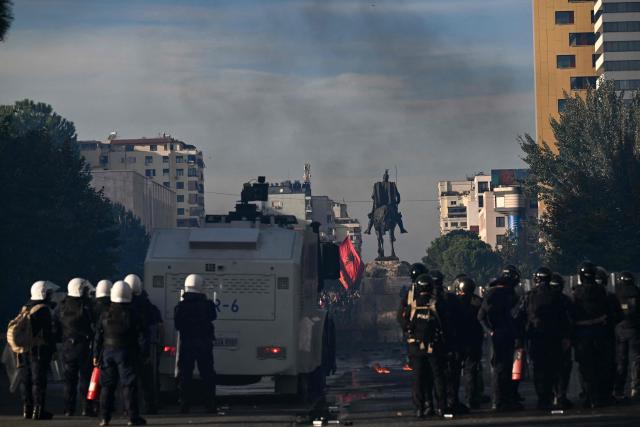 Riot police face protesters during a national anti-government demonstration - called by the student-led protest movement to demand better support for education and prime minister's resignation, in central Tirana on October 24, 2026. (Photo by Armend NIMANI / AFP)