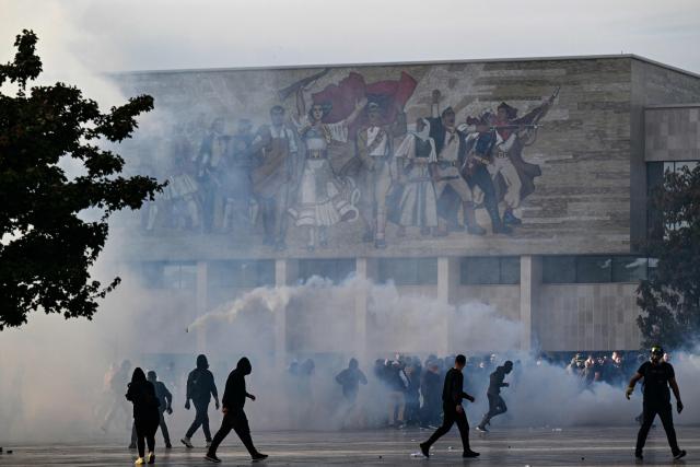 Protesters clash with riot police during a national anti-government demonstration - called by the student-led protest movement to demand better support for education and prime minister's resignation, in central Tirana on October 24, 2026. (Photo by Armend NIMANI / AFP)