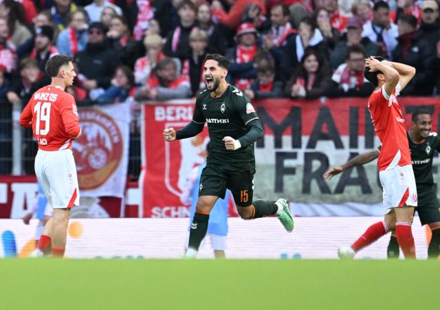 Bremen's Dutsch midfielder #15 Ludovit Reis (C) celebrates scoring during the German first division Bundesliga football match between Mainz 05 and Werder Bremen in Mainz on October 24, 2026. (Photo by Kirill KUDRYAVTSEV / AFP) / DFL REGULATIONS PROHIBIT ANY USE OF PHOTOGRAPHS AS IMAGE SEQUENCES AND/OR QUASI-VIDEO