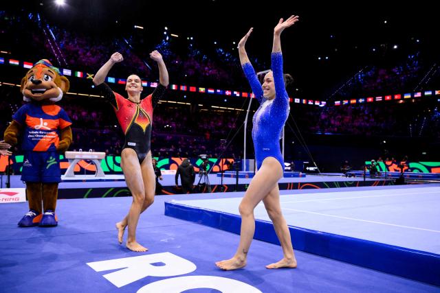 (From L) Silver medallist Germany's Helen Kevric and gold medallist Algeria's Kaylia Nemour celebrate after the Women's Uneven Bars Final during the 54th FIG Artistic Gymnastics World Championships, in Rotterdam, southern Netherlands, on October 24, 2026. (Photo by JOHN THYS / AFP)