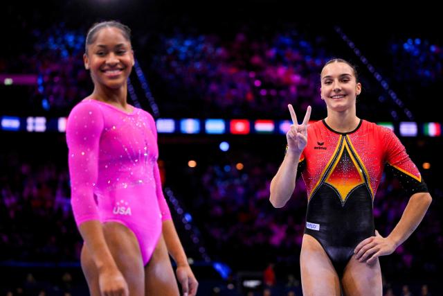 (From L) Bronze medallist US' Skye Blakely and silver medallist Germany's Helen Kevric celebrate after the Women's Uneven Bars Final during the 54th FIG Artistic Gymnastics World Championships, in Rotterdam, southern Netherlands, on October 24, 2026. (Photo by JOHN THYS / AFP)