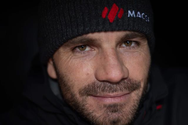 French skipper Corentin Horeau poses for a photograph aboard his Imoca class boat "MACSF" a week ahead of the start of the 13th Route du Rhum solo sailing race from Saint-Malo to Pointe-a-Pitre, in the French West Indies island of Guadeloupe, on October 24, 2026. (Photo by Sebastien Salom-Gomis / AFP)