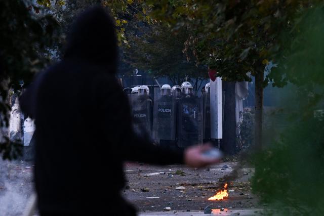 Protesters clash with riot police during a national anti-government demonstration - called by the student-led protest movement to demand better support for education and prime minister's resignation, in central Tirana on October 24, 2026. (Photo by Armend NIMANI / AFP)