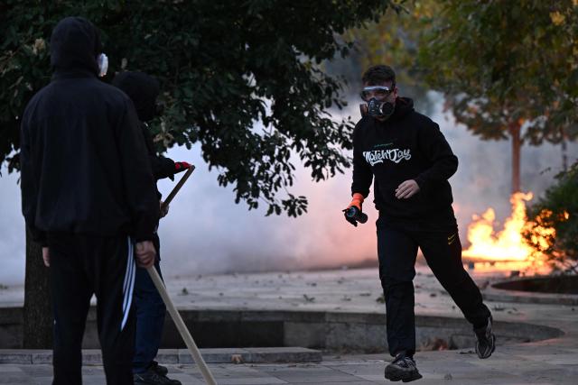 Protesters clash with riot police during a national anti-government demonstration - called by the student-led protest movement to demand better support for education and prime minister's resignation, in central Tirana on October 24, 2026. (Photo by Armend NIMANI / AFP)