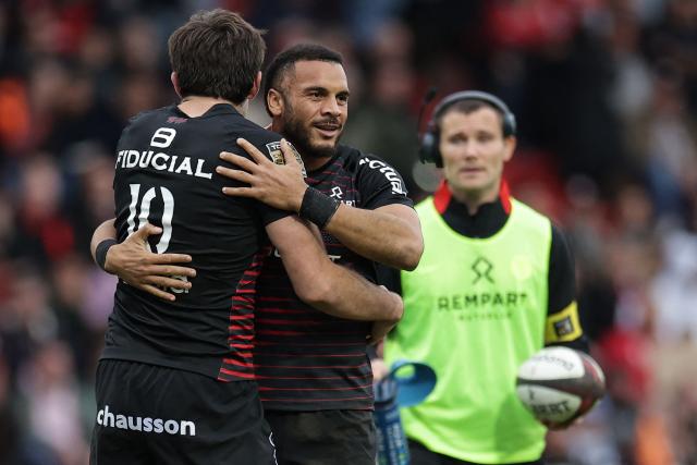 Toulouse's French wing Matthis Lebel (C) celebrates with Toulouse's Scottish fly-half Blair Kinghorn (L) after scoring a try during the French Top14 rugby union match between Stade Toulousain and USA Perpignan at the Ernest Wallon Stadium in Toulouse, southwestern France, on October 24, 2026. (Photo by Valentine CHAPUIS / AFP)