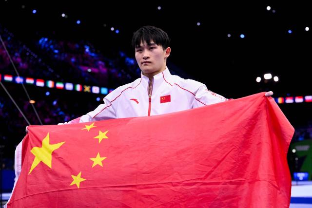 China's Xingyu Lan celebrates after winning the Men's Rings Final during the 54th FIG Artistic Gymnastics World Championships, in Rotterdam, southern Netherlands, on October 24, 2026. (Photo by JOHN THYS / AFP)